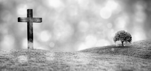 grayscale illustration is depicting wooden cross on misty grassy hill, with solitary tree and bokeh