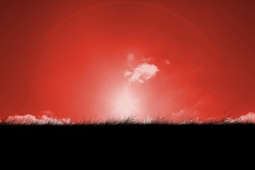 Digitally generated Red sky over grass