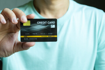 Woman holding several credit cards and he is choosing a credit card to pay and spend Payment for goods via credit card. Finance and banking concept	
