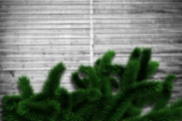 Obraz premium Blurred fir branches on wood