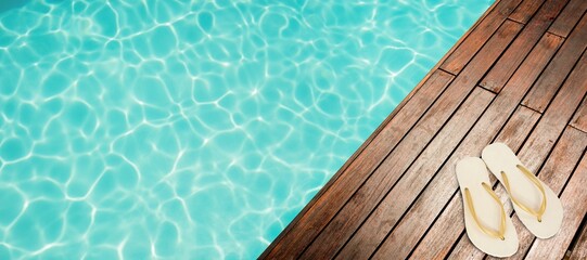 Flip-flop on pier by swimming pool