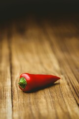 Red hot pepper on wooden table