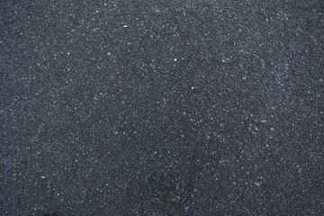 Realistic vector illustration showing rough asphalt surface with small stones and fine cracks