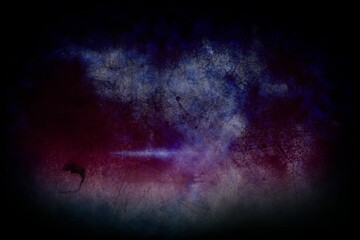 Abstract grunge texture spreading across frame, mixing dark purple and red into deep blue smears
