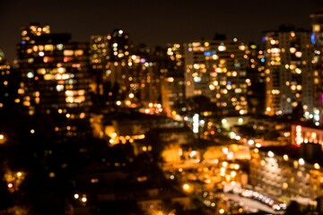 Defocused image of illuminated city at night