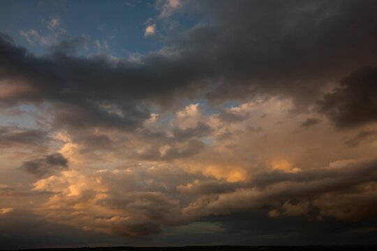 Fototapeta Blue and orange sky with clouds