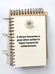 Inspirational life quote on blurry background. A dream becomes a goal when action is taken toward...