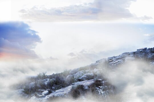 Fototapeta Flat design landscape is featuring rocky hillside with shrubs and mist under pastel cloudy sky