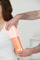 Physiotherapist holding woman hand