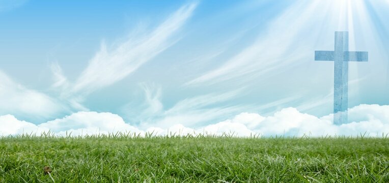 Fototapeta Flat design translucent cross is overlaying bright sky with sunrays and fluffy clouds over meadow