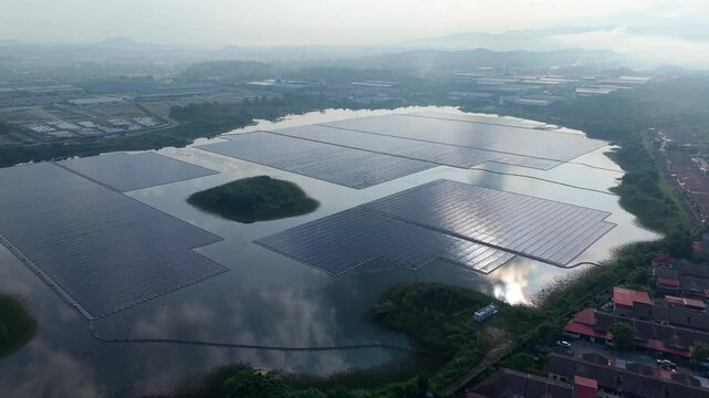 Aerial view of a floating solar panel farm concept on a serene tropical lake in Rawang, Malaysia. Clean renewable energy landscape in Southeast Asia.