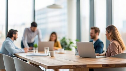 Fototapeta premium Defocused business setting capturing teamwork across in-person and virtual participants 