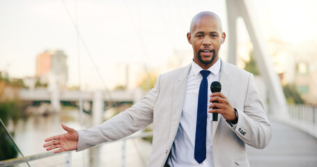 Microphone, news and portrait of black man in city for live television broadcast as presenter....