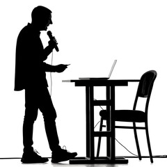 Silhouette Man Speaking into Microphone at Table with Laptop