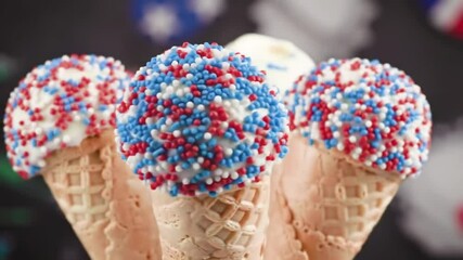 Patriotic ice cream cones decorated with red white and blue sprinkles background