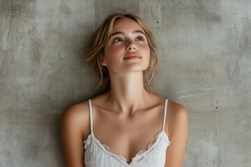 Naklejka premium Cheerful young woman in white dress, looking upwards and contemplating, symbolizing optimism and future goals, Generative AI
