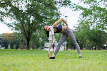 Young asian female exercise in park in morning, Happy and smiled woman workout and relax before...
