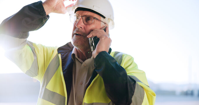 Contractor, man or stress with phone call on site for building inspection fail, problem or feedback. Construction, mature person and talking to contact for project management, safety risk and mistake - Powered by Adobe