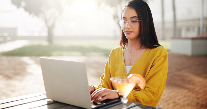 Freelancer, cocktail and woman with laptop in park for feedback, online review or tourism blog. Outdoor, drink or digital nomad typing on technology for remote work or research for travel hospitality - Powered by Adobe