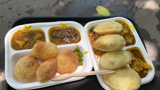 Two plates of club kachori and peas kachori sold in streets in Kolkata, India 
