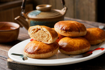 Close Up of Traditional Tau Sar Piah Chinese Pastry with Mung Bean Filling on Rustic Surface