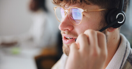 Call center, agent and man with headset, chat and communication with contact, talk or...
