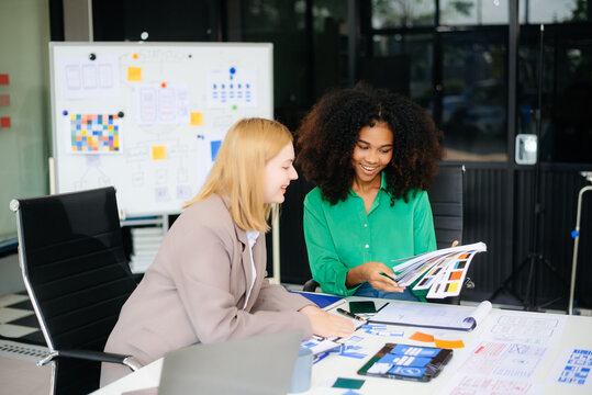 business team people meeting in office. Employee brainstorm and work as team, plan and discuss project by point on paper and tablet.