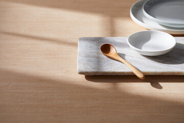 Light and Shadow on Wooden Texture with Modern Objects. Minimal Home Decor Scene with Ceramic Trays.