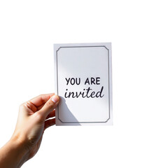 Hand Holding Invitation Card with You Are Invited Text on White Background for Event and Celebration Themes