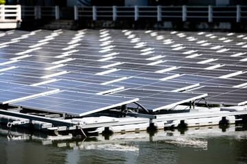 Selective focus to solar power station. Solar photovoltaic power station on water. Solar panels or...