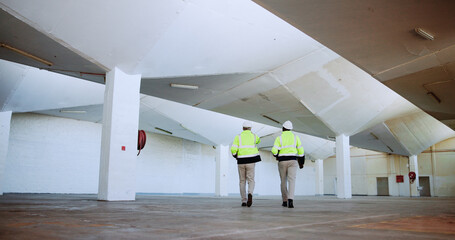 Men, architect and inspection with point at warehouse, talk and review for design at plant. People,...