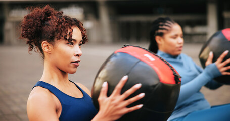 Workout, medicine ball and teamwork with women in city for challenge, fitness and performance. Health, wellness and commitment with friends outdoor for training partner, exercise club and sports