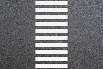 Empty crosswalk on asphalt road with black and white sign on sidewalk curb. top view	