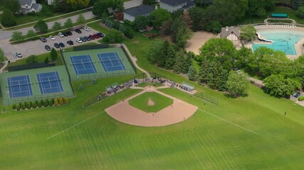 Baseball Players Playing During Match On A Sunny Day. Aerial shot - Powered by Adobe
