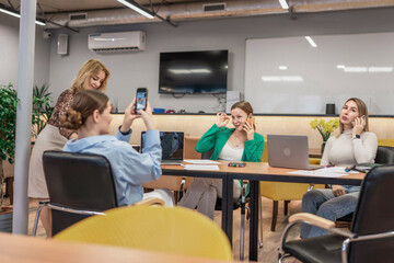 Naklejka premium Office women teamwork phonecall, photo taken during daytime in meeting room for presentation.