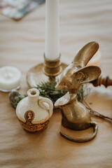 brass candlestick and figurines for wedding table decor