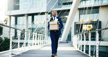 Naklejka premium Happy, black man or leaving business with box for new career, job opportunity or migration in city. Businessman, change or startup with work equipment for relocation or employment promotion on bridge