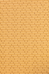 A wall made of yellow bricks