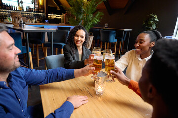 African and Caucasian friends celebrating their Caucasian friends huge achievement