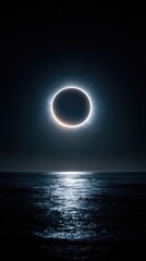 Obraz premium Lunar eclipse over a dark ocean.