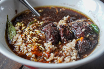Rawon, East Java, Indonesia, captured on July 4, 2025. Traditional beef soup with rich black broth made from keluak nuts, served with rice, bean sprouts, and salted egg for a bold and aromatic flavor.