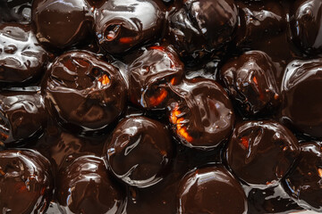 Classic profiteroles coated in rich, glossy dark chocolate sauce