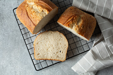 A top down view of a cut rustic sourdough loaf.