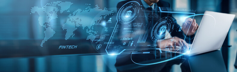 A businessman using a laptop analyzes FinTech growth data to leverage global network opportunities,...