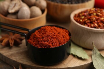 Different aromatic spices on wooden table, closeup