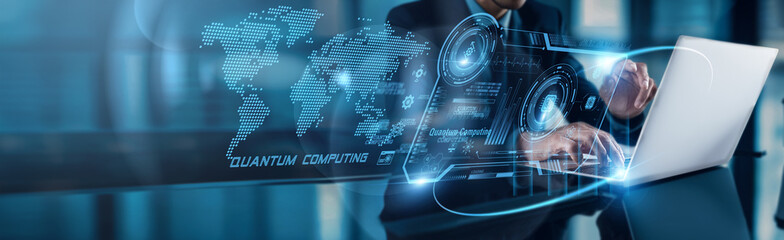 Businessman using laptop with analysis data of Quantum Computing driving exponential growth to on...
