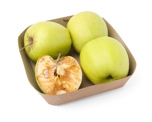 Spoiled apple and good ones in box isolated on white
