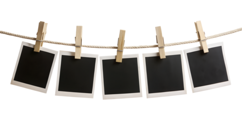 blank photo frames hanging on rope