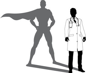 A superhero medical doctor man health care worker revealed by his shadow silhouette as a super hero in a cape.