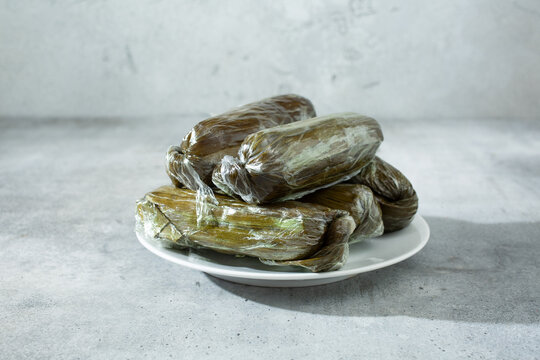 A view of some white suman pastries, on a plate.